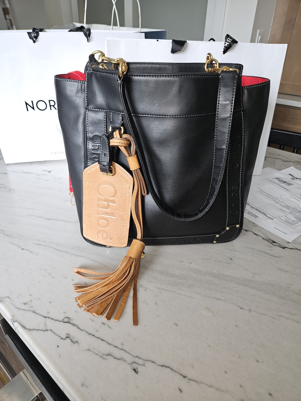 Black Leather Chloe Eden Tote with Tan Tassel Charm. Authenticity Guaranteed